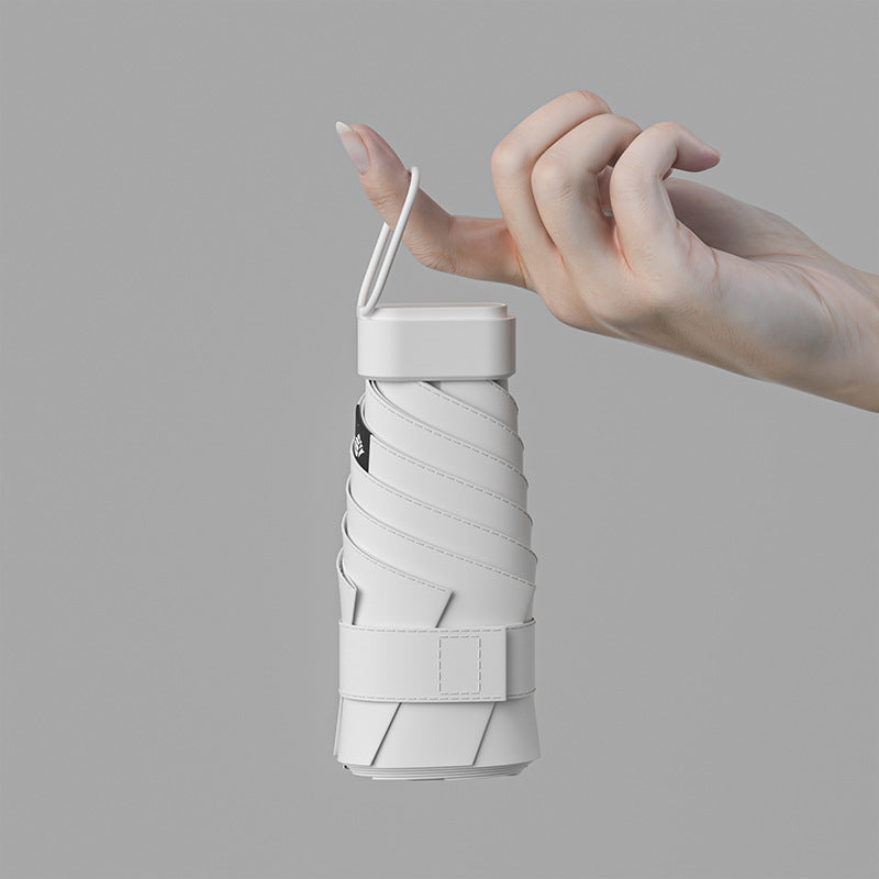 50% fold flat round umbrella for sunny and rainy days Women's sun umbrella sunscreen anti-ultraviolet capsule umbrella folding mini sunshade umbrella